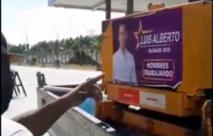 SDE: Ponen afiches candidato PLD a maquinarias asfaltan calles